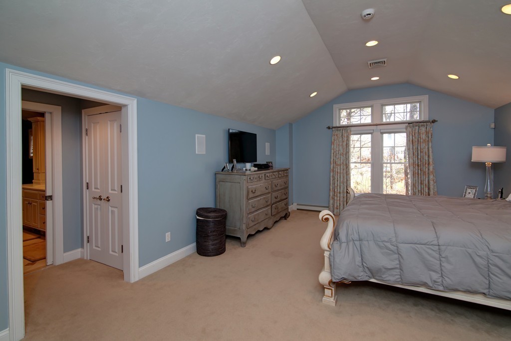 84 Troon Place Mashpee, MA 02649 - Photo 21 of 30 a bed room with a bed and a tv