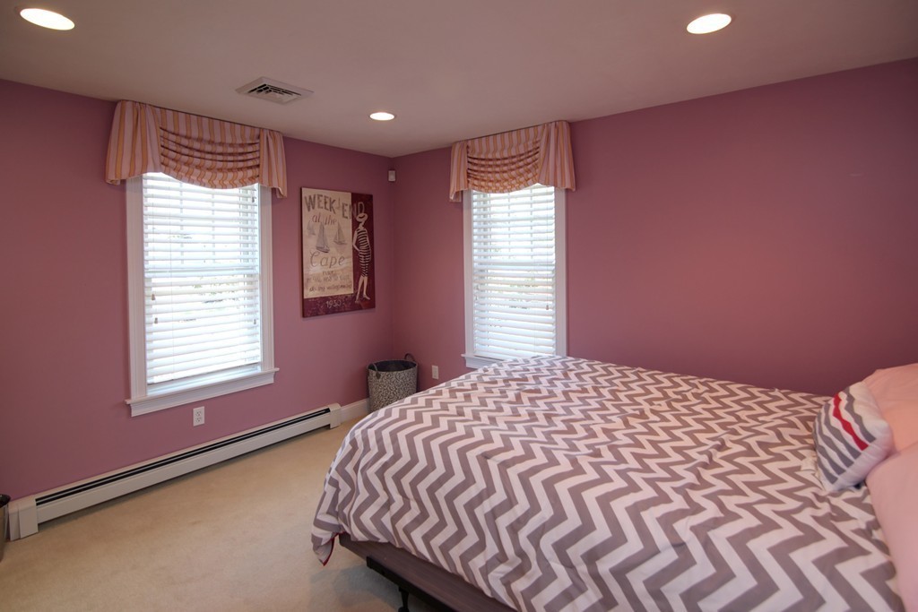84 Troon Place Mashpee, MA 02649 - Photo 23 of 30 a bedroom with a bed and a window