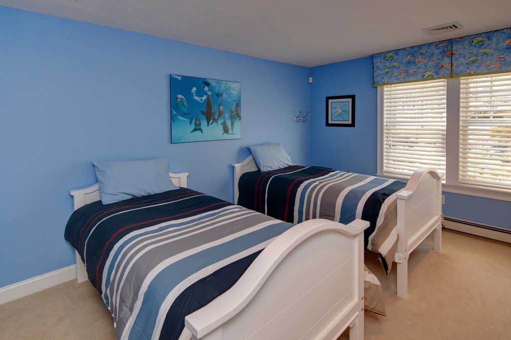 84 Troon Place Mashpee, MA 02649 - Photo 24 of 30 a bedroom with two beds and a window