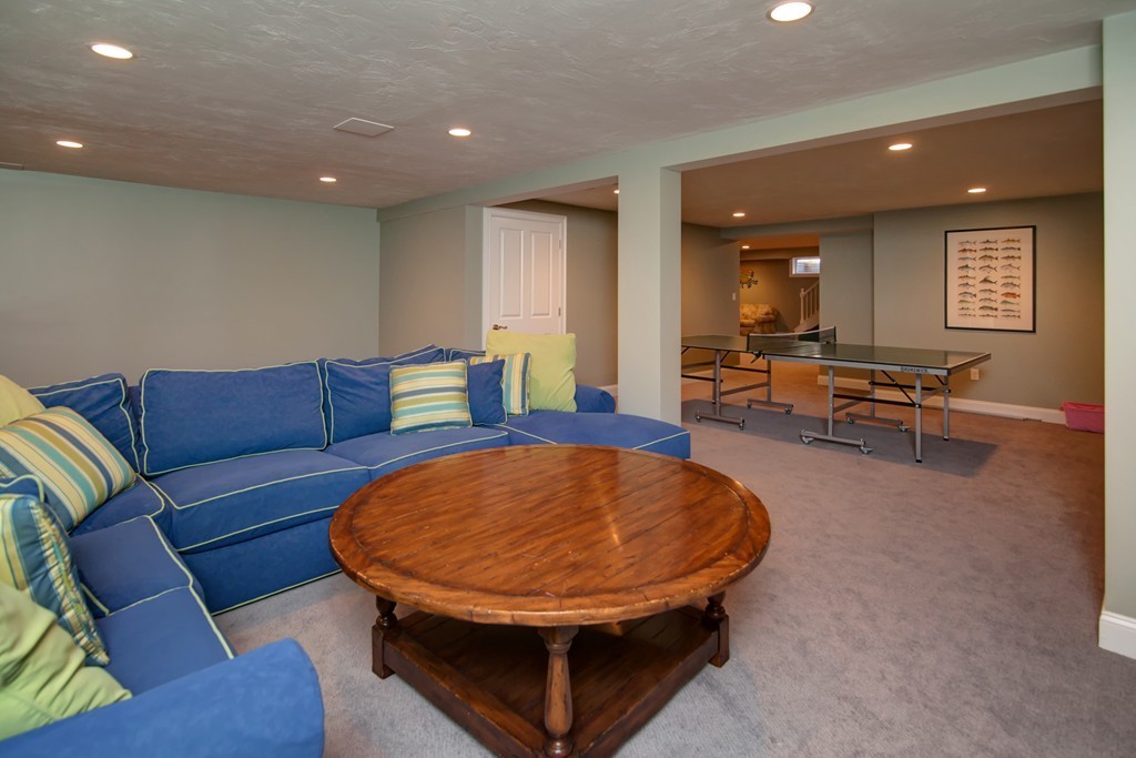 84 Troon Place Mashpee, MA 02649 - Photo 25 of 30 a living room with furniture a table and chairs in it