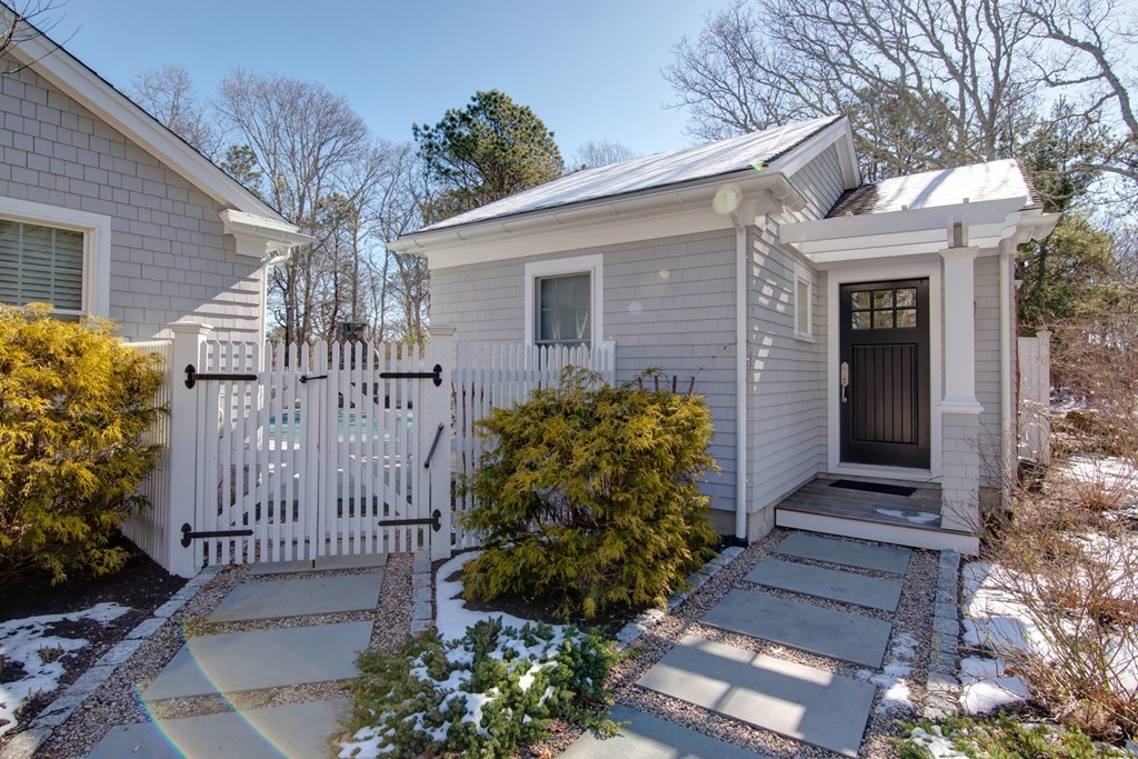 84 Troon Place Mashpee, MA 02649 - Photo 26 of 30 a view of a house with a small yard and plants