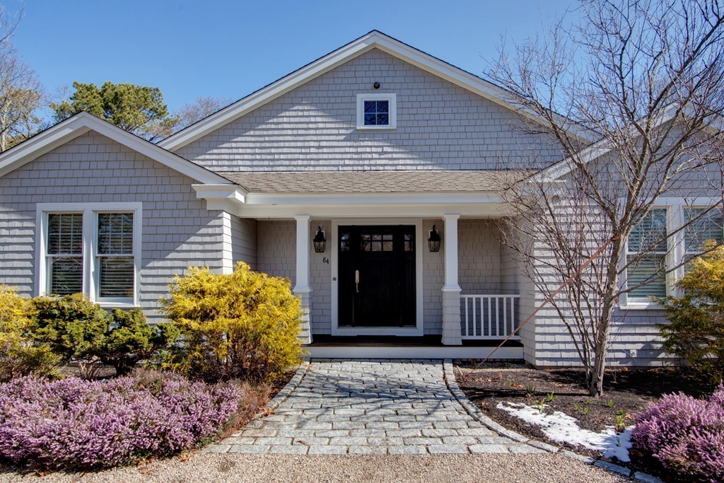 84 Troon Place Mashpee, MA 02649 - Photo 30 of 30 a front view of a house with garden