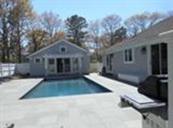 84 Troon Place Mashpee, MA 02649 - Photo 4 of 30 a front view of a house with yard