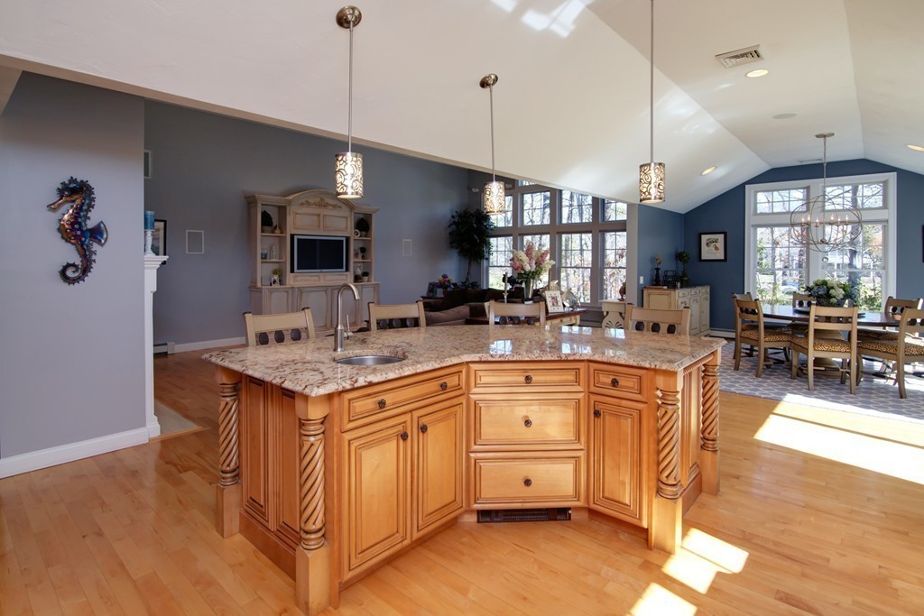 84 Troon Place Mashpee, MA 02649 - Photo 7 of 30 a kitchen with stainless steel appliances kitchen island a large island in the center