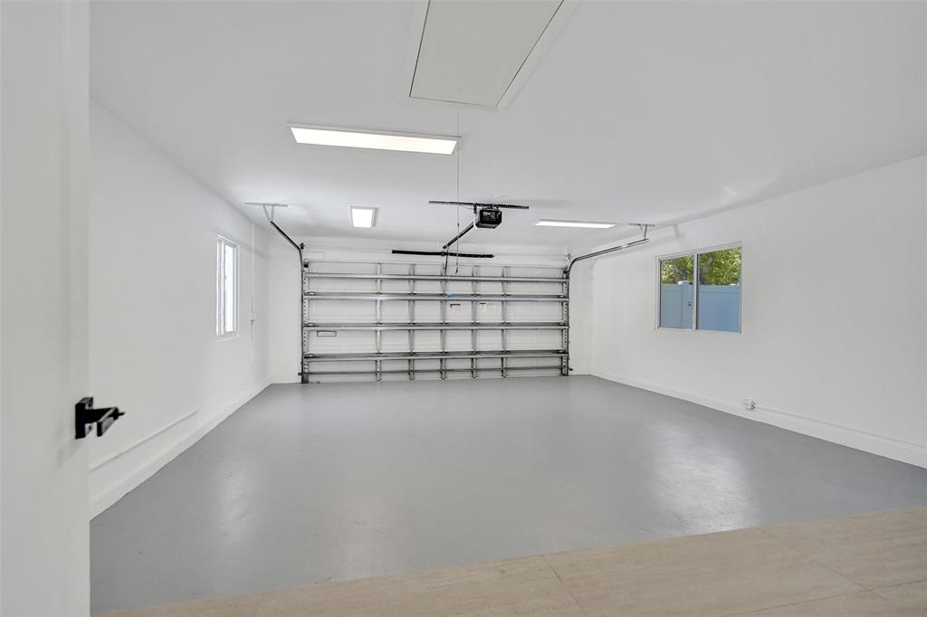 699 Northeast 70th Street Boca Raton, FL 33487 - Photo 42 of 60 an empty room with windows and ceiling fan