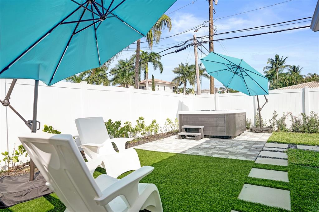 699 Northeast 70th Street Boca Raton, FL 33487 - Photo 48 of 60 a view of an outdoor sitting area with backyard