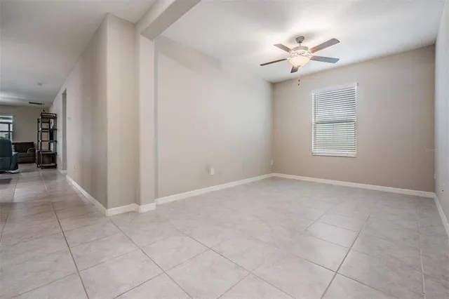 a bathroom with a granite countertop sink two mirror and shower