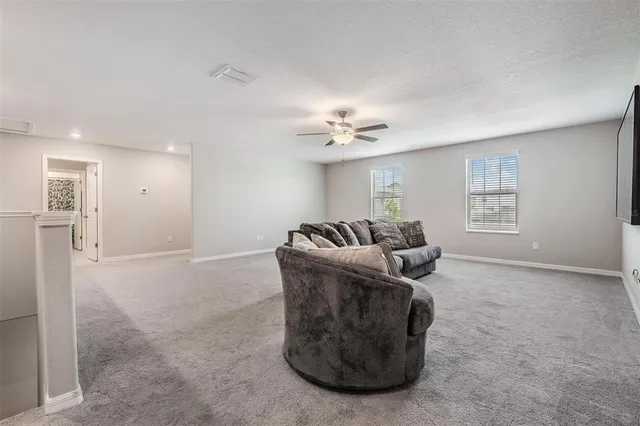 a view of a floor to ceiling window and an ocean view