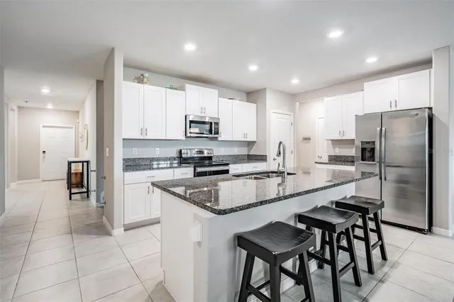 a kitchen with counter top space and appliances