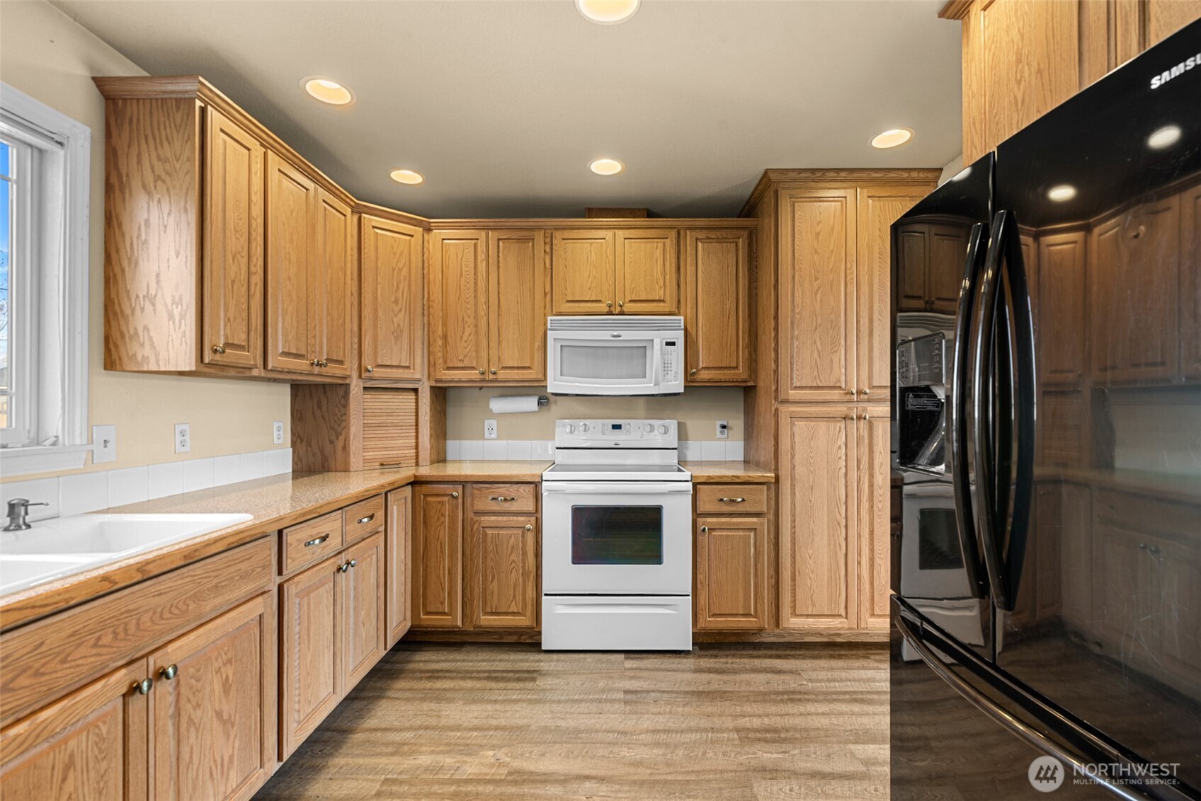 523 K Street Southwest Quincy, WA 98848 - Photo 16 of 35 a kitchen with stainless steel appliances a refrigerator sink and cabinets