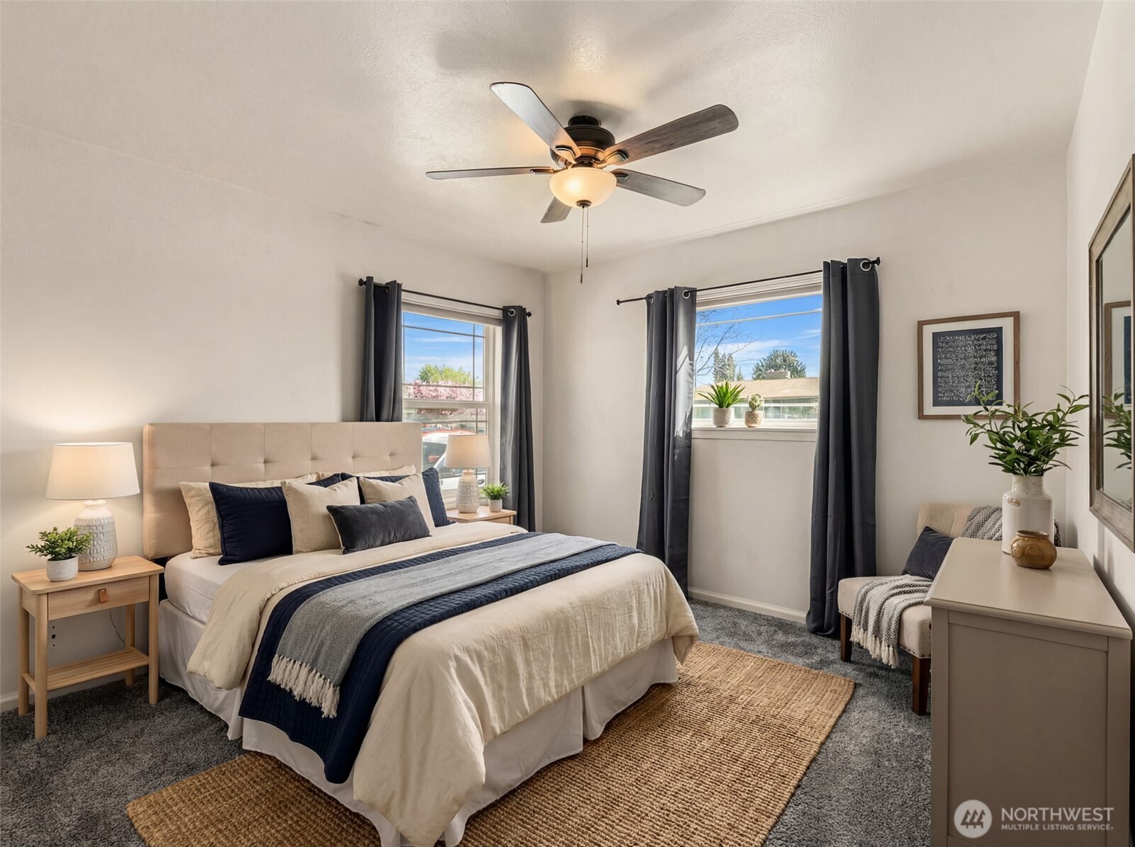 523 K Street Southwest Quincy, WA 98848 - Photo 21 of 35 a bedroom with bed and a chandelier