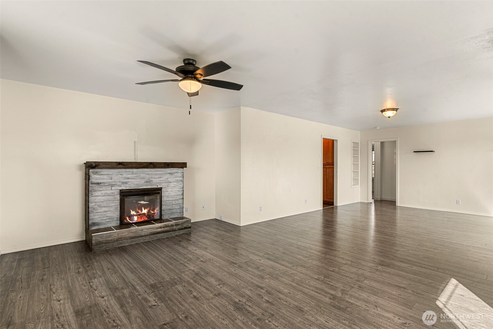 523 K Street Southwest Quincy, WA 98848 - Photo 3 of 35 a view of an empty room with wooden floor fireplace and a window