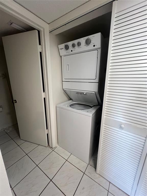 1330 Rio De Janeiro Avenue, Unit 5 Punta Gorda, FL 33983 - Photo 13 of 17 a utility room with dryer and washer