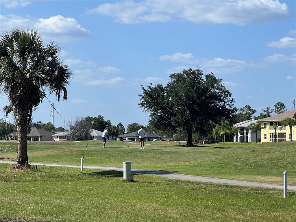 1330 Rio De Janeiro Avenue, Unit 5 Punta Gorda, FL 33983 - Photo 15 of 17 a view of a golf course