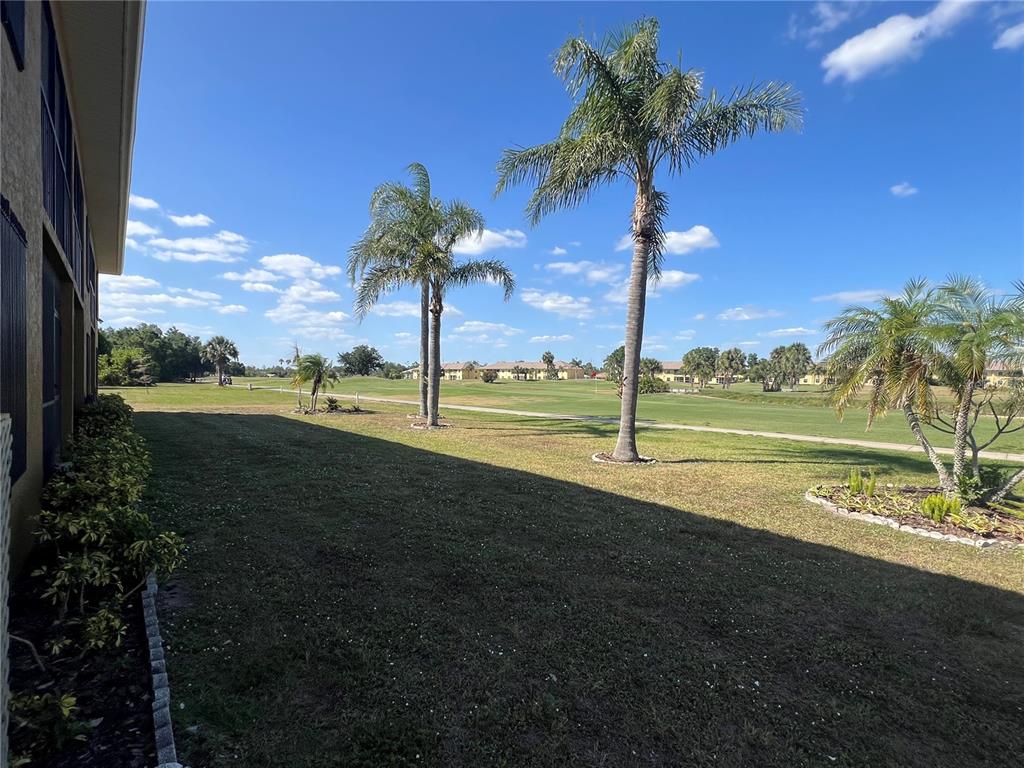 1330 Rio De Janeiro Avenue, Unit 5 Punta Gorda, FL 33983 - Photo 16 of 17 a view of a park with palm trees