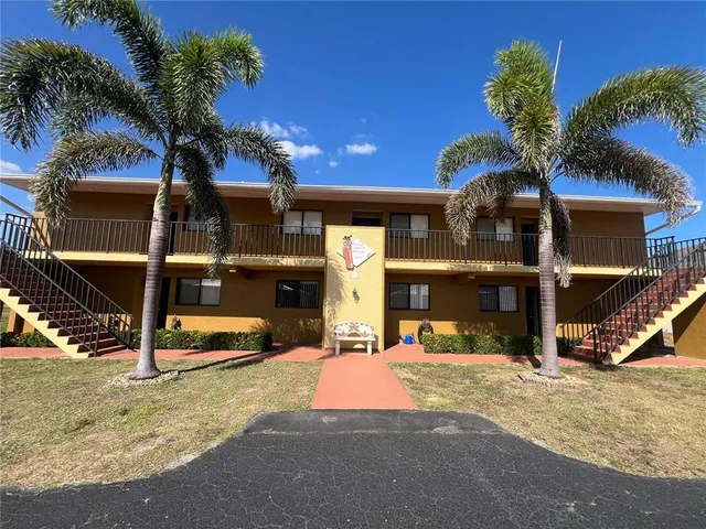 a view of a house with basketball court
