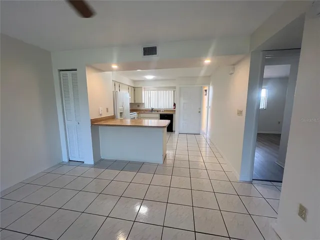 a kitchen with stainless steel appliances a sink and cabinets