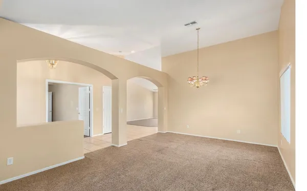 a view of a room with a ceiling fan