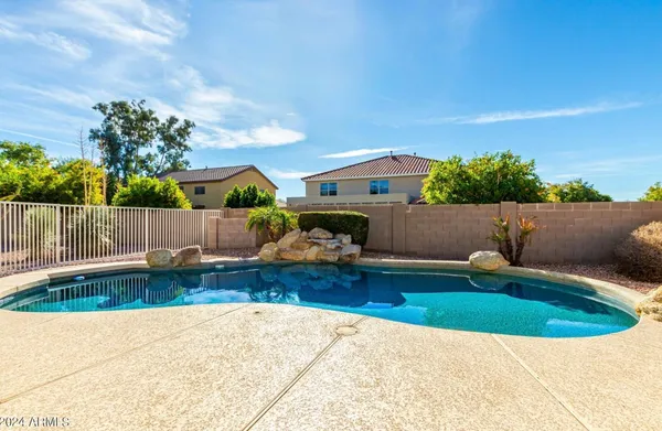 a view of swimming pool with seating space