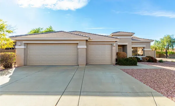 a front view of a house with a garage
