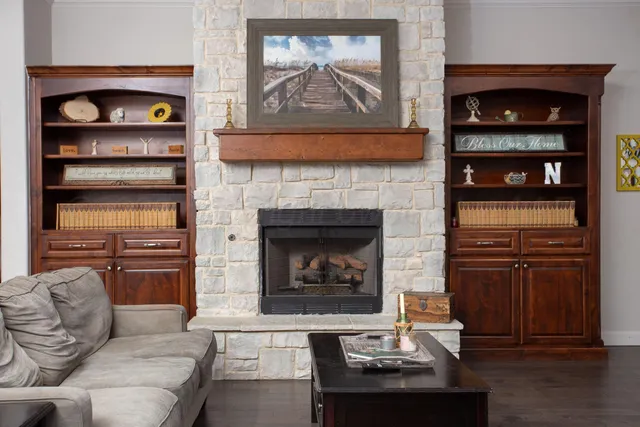 a living room with furniture and a fireplace