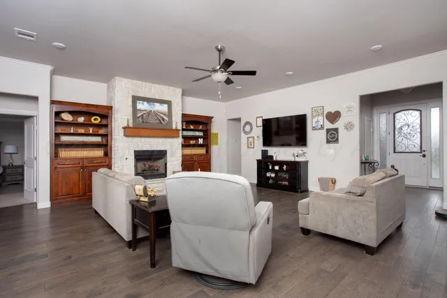 a living room with furniture and a fireplace
