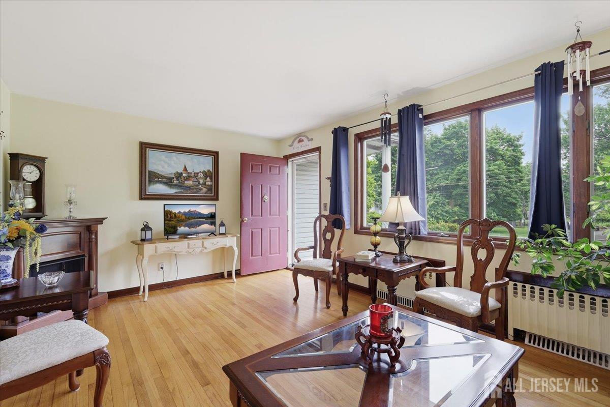 33 Ellison Road Somerset, NJ 08873 - Photo 3 of 38 a living room with furniture and large windows