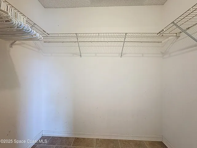 a view of a room with racks on the wall