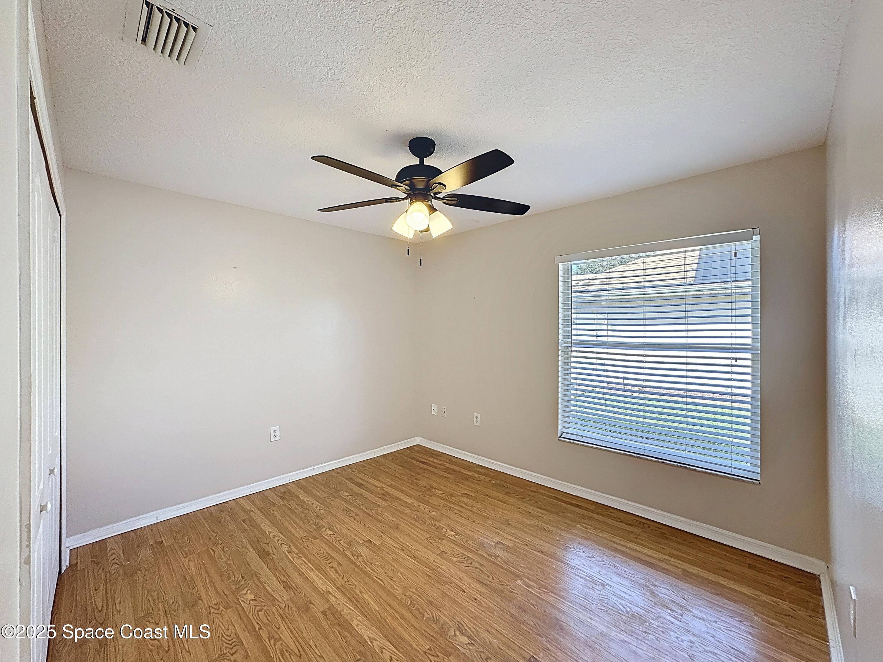 7370 Joshua Place Cocoa, FL 32927 - Photo 12 of 21 a view of an empty room with a window