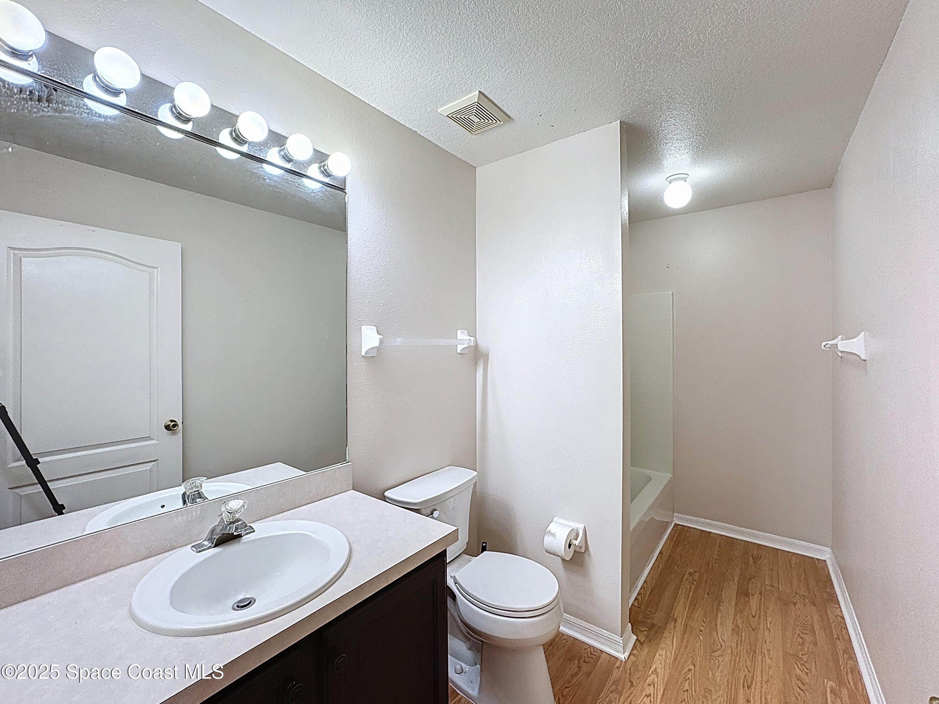 7370 Joshua Place Cocoa, FL 32927 - Photo 14 of 21 a bathroom with a sink and a mirror