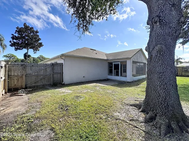 a house with trees in the background