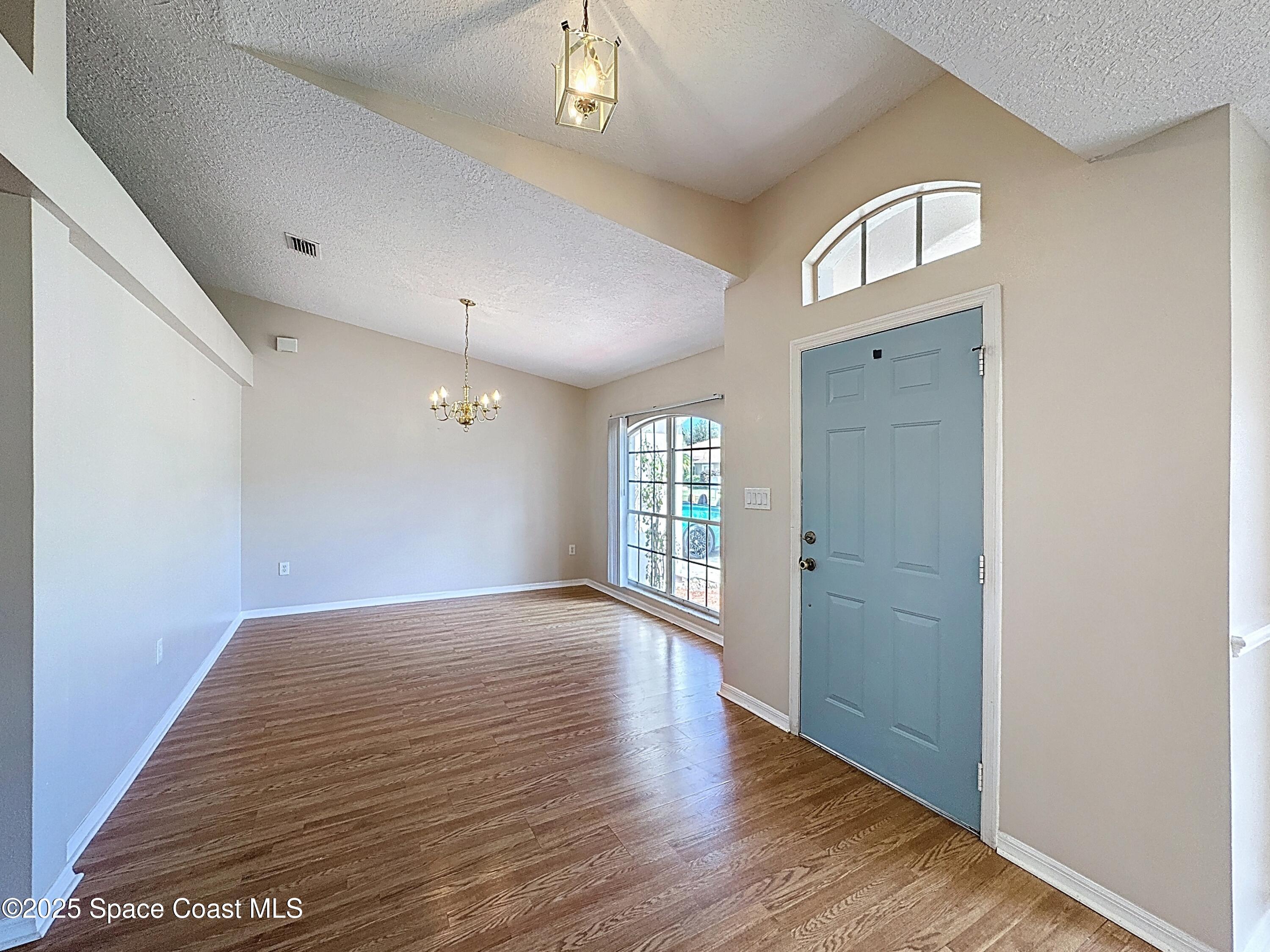 7370 Joshua Place Cocoa, FL 32927 - Photo 3 of 21 a view of an empty room and window