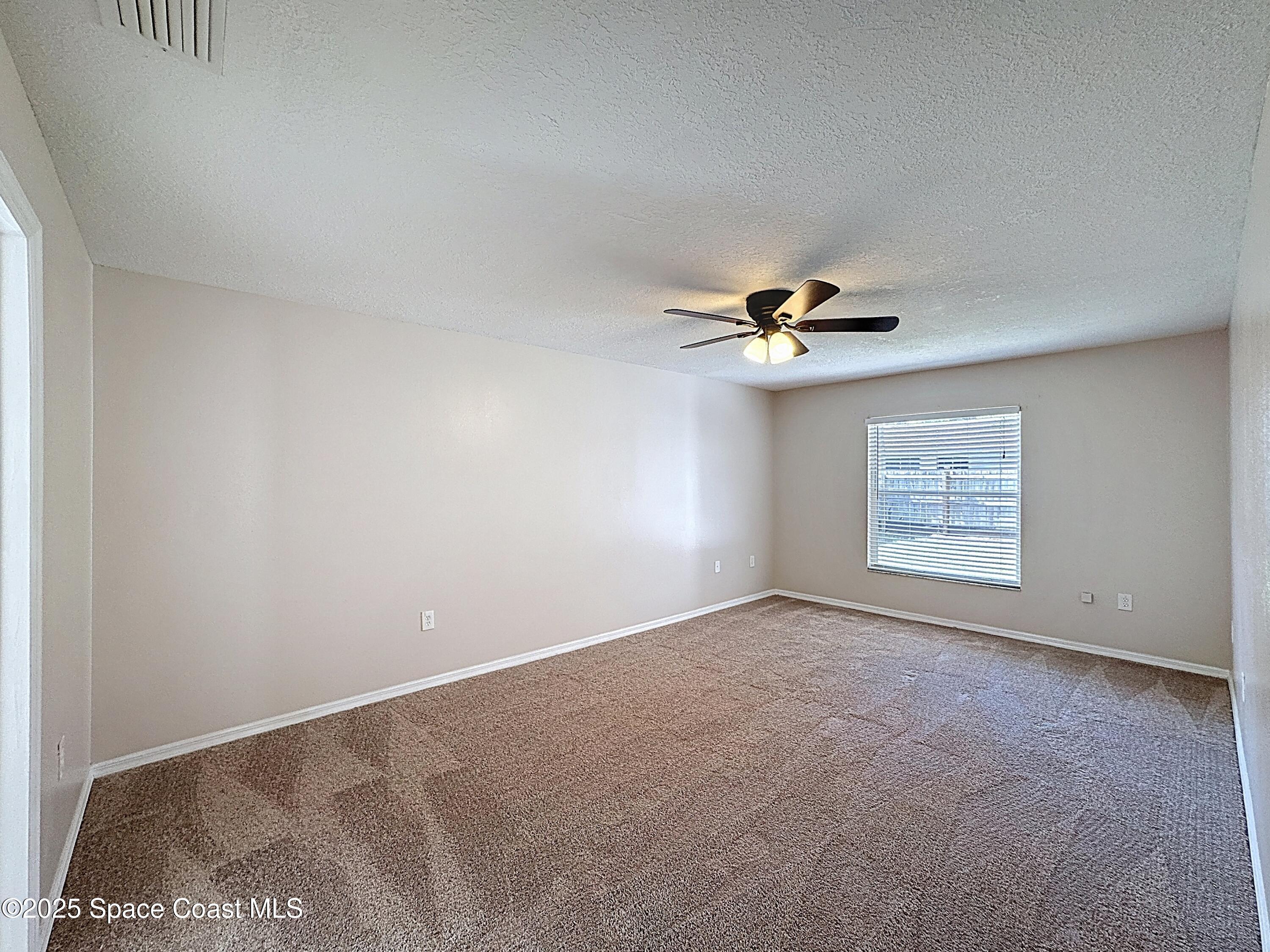 7370 Joshua Place Cocoa, FL 32927 - Photo 9 of 21 a view of an empty room
