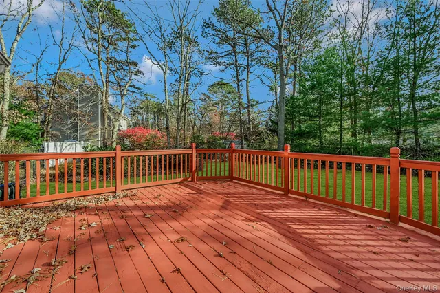 a view of deck with wooden floor and fence