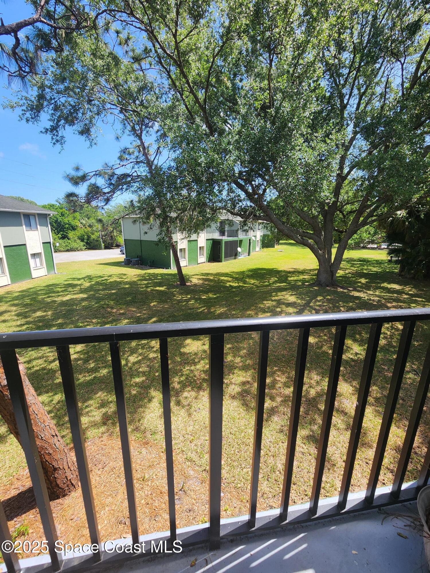 2220 Flower Tree Circle Melbourne, FL 32935 - Photo 14 of 22 a view of outdoor space with deck