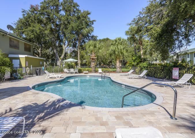 2220 Flower Tree Circle Melbourne, FL 32935 - Photo 17 of 22 a view of a backyard with a garden