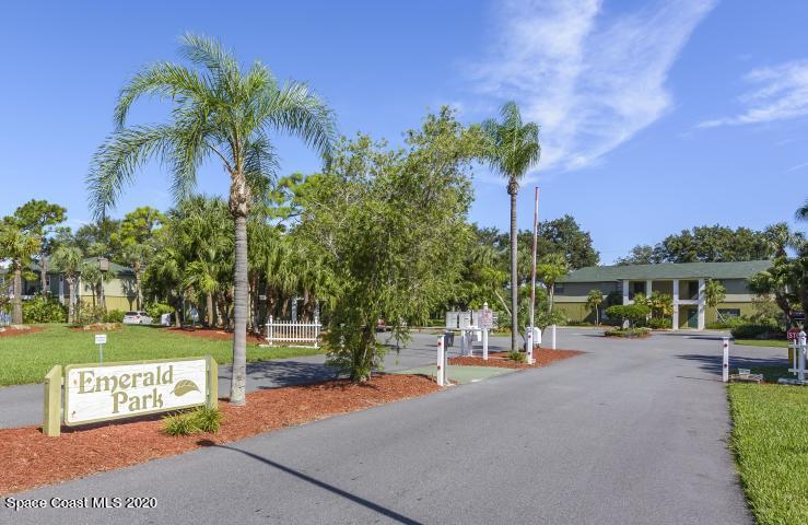 2220 Flower Tree Circle Melbourne, FL 32935 - Photo 18 of 22 a view of a park with bench palm trees