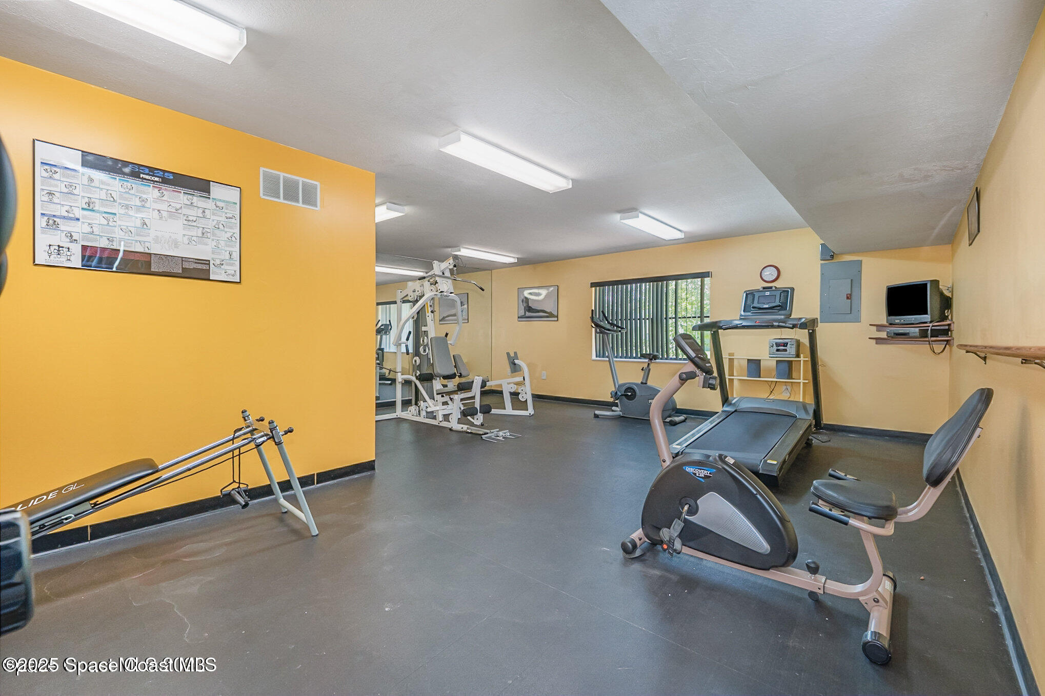 2220 Flower Tree Circle Melbourne, FL 32935 - Photo 19 of 22 a view of a room with gym equipment