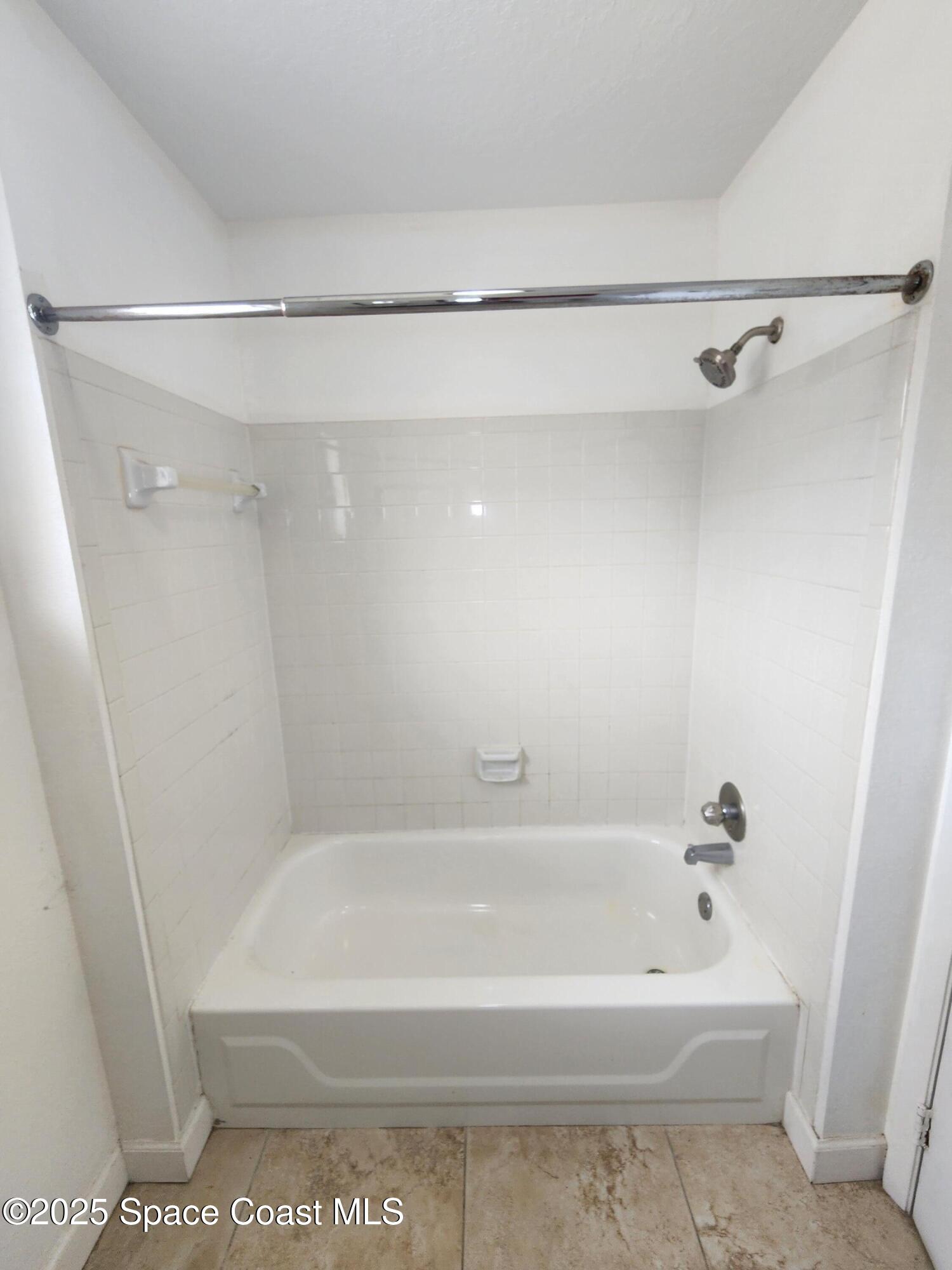 2220 Flower Tree Circle Melbourne, FL 32935 - Photo 8 of 22 a bathroom with a shower and a bath tub