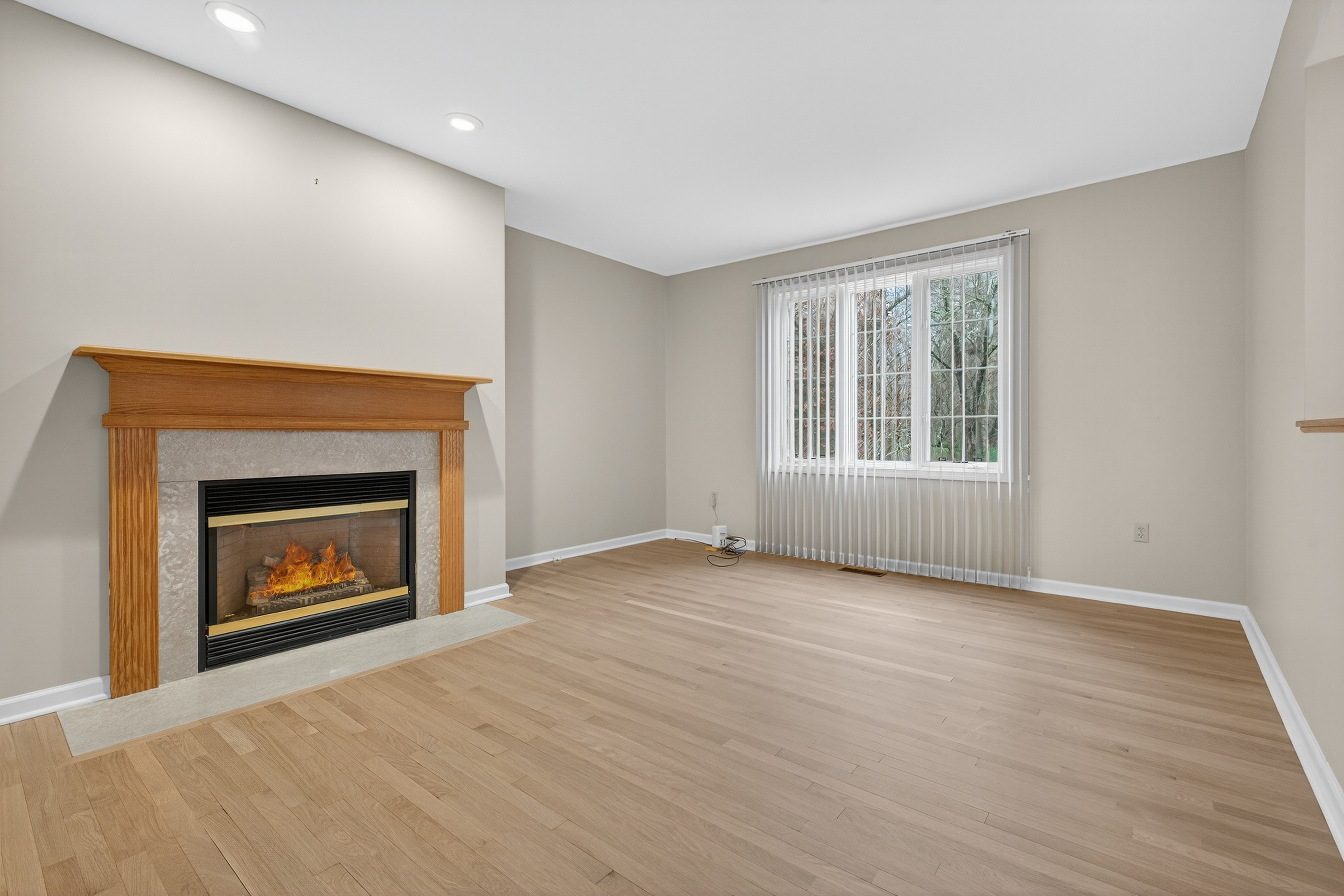 43 Copley Road, Unit 43 Glastonbury, CT 06073 - Photo 16 of 37 a view of an empty room with a fireplace and a window