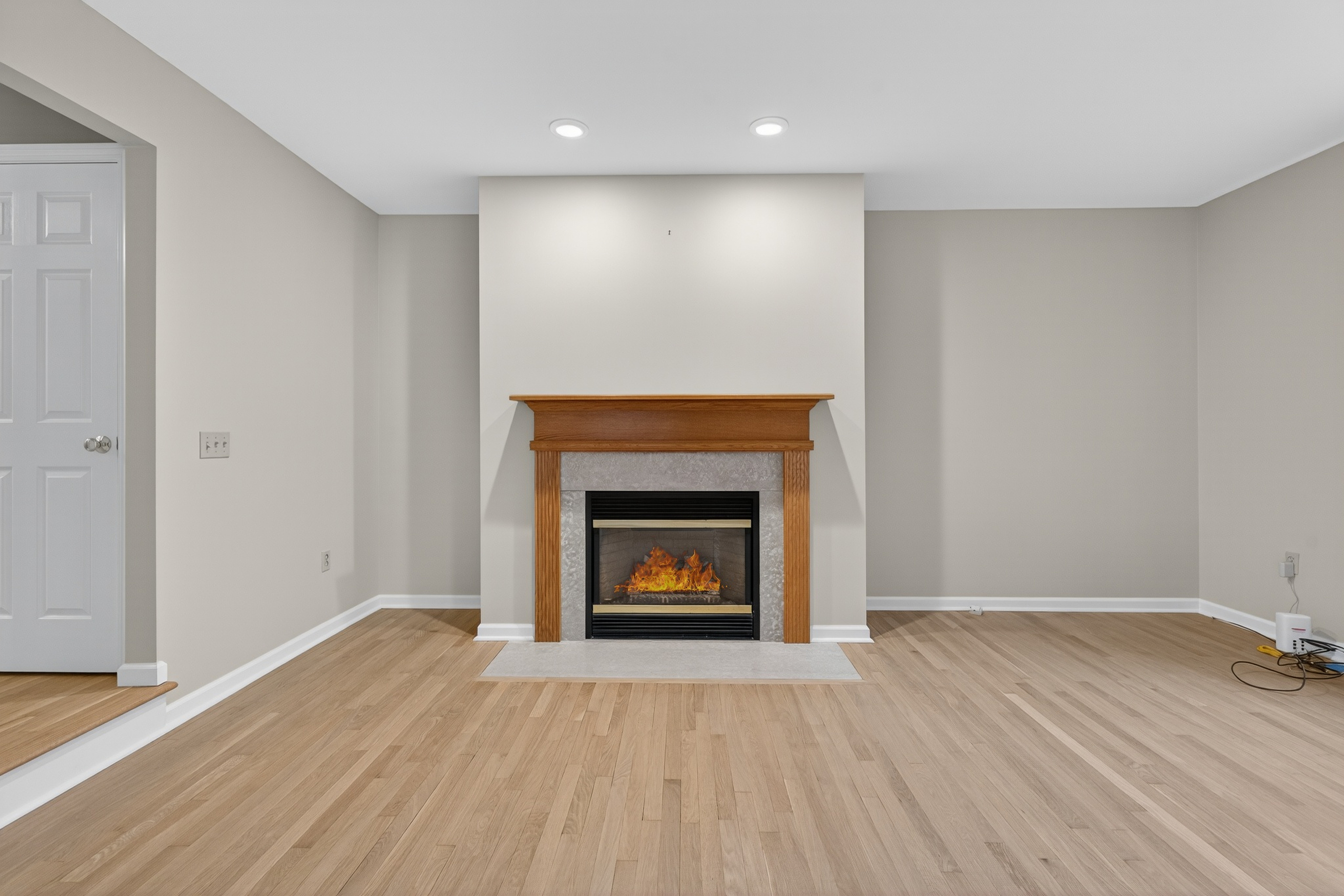 43 Copley Road, Unit 43 Glastonbury, CT 06073 - Photo 17 of 37 a view of an empty room with wooden floor fireplace and a window