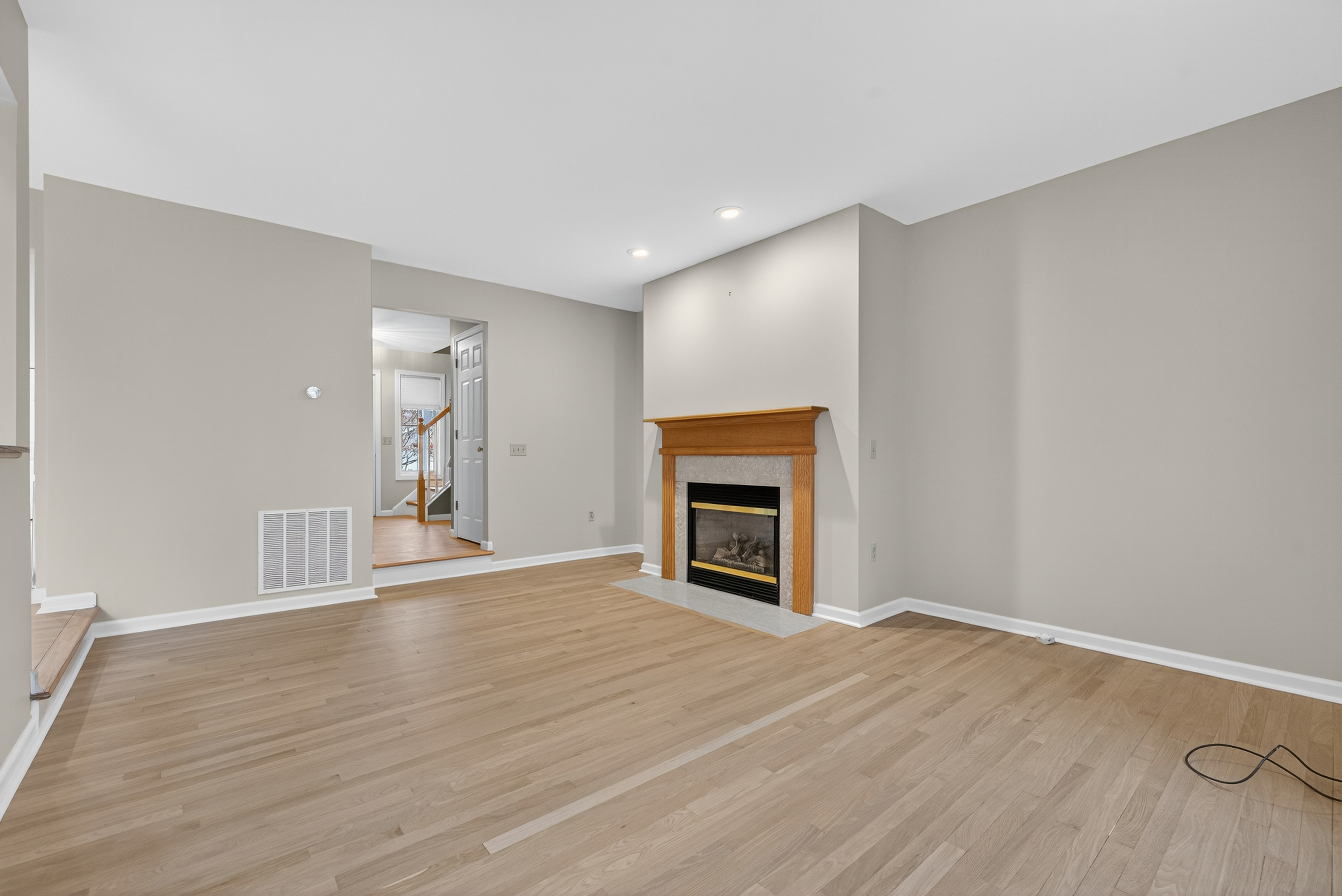 43 Copley Road, Unit 43 Glastonbury, CT 06073 - Photo 18 of 37 a view of empty room with wooden floor and fireplace