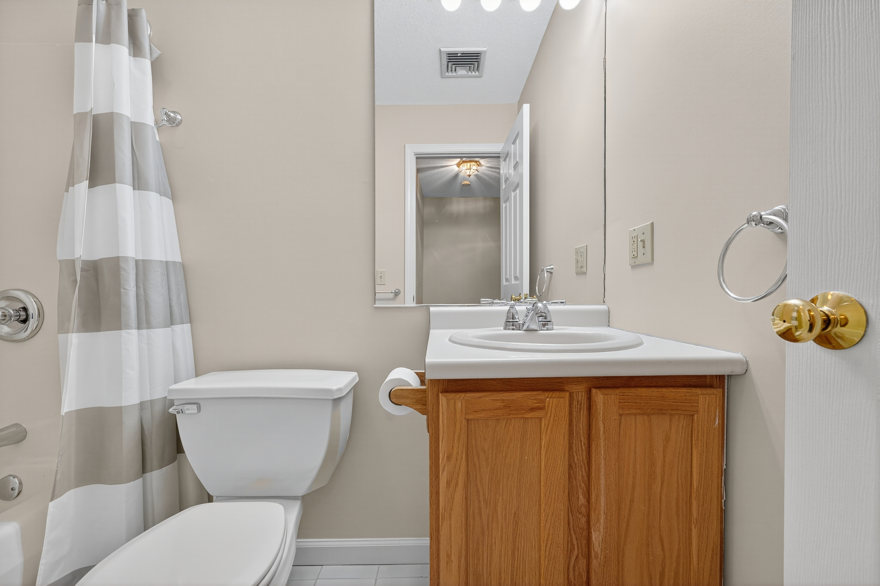 43 Copley Road, Unit 43 Glastonbury, CT 06073 - Photo 31 of 37 a bathroom with a toilet a sink and mirror