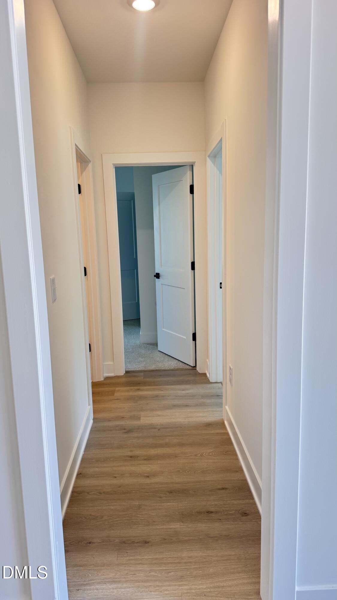 20 Streamline Court Lillington, NC 27546 - Photo 4 of 46 a view of a hallway with wooden floor