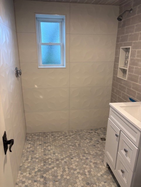 189 River Street, Unit 6 Waltham, MA 02453 - Photo 7 of 9 a bathroom with a sink toilet and shower