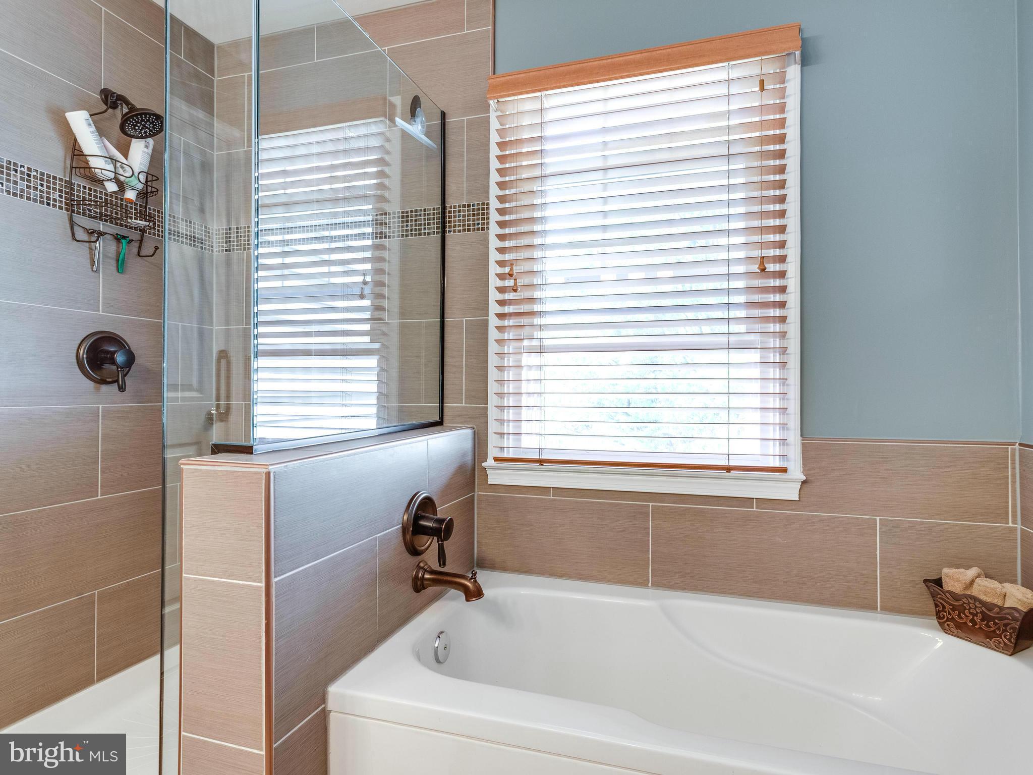 1215 Weatherstone Court Reston, VA 20194 - Photo 17 of 30 a white bath tub sitting next to a window