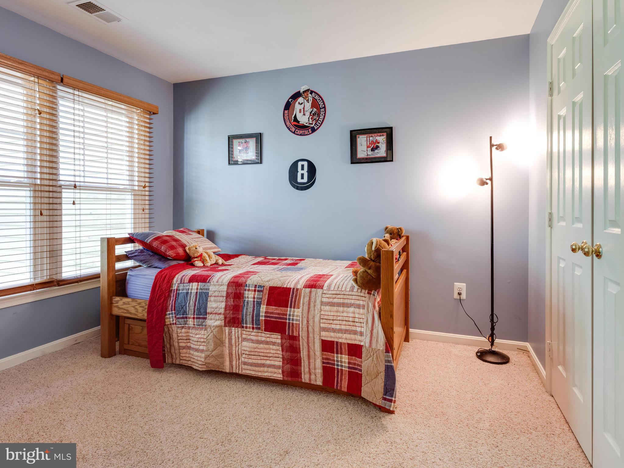 1215 Weatherstone Court Reston, VA 20194 - Photo 19 of 30 a bedroom with a bed and a window