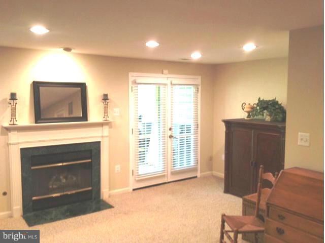 1215 Weatherstone Court Reston, VA 20194 - Photo 24 of 30 a living room with furniture and a fireplace