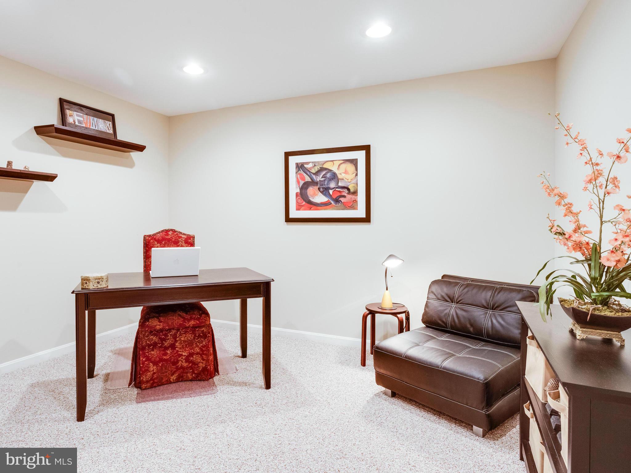 1215 Weatherstone Court Reston, VA 20194 - Photo 25 of 30 a living room with furniture and a couch