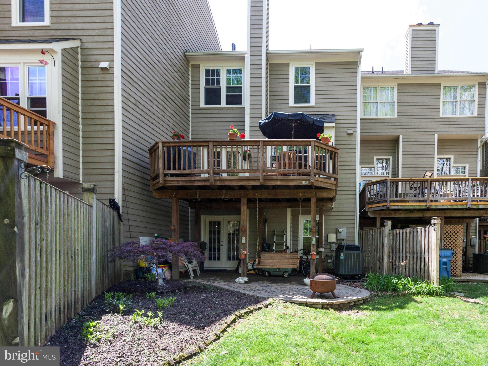 1215 Weatherstone Court Reston, VA 20194 - Photo 28 of 30 a front view of a house with porch and garden